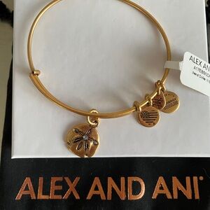 Alex and Ani Rafaelian Gold Sand Dollar with blue Swarovski Charm Bangle